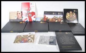 A collection of Royal Mint uncirculated coinage to include, two 2008 Royal Shield of Arms/ Emblems