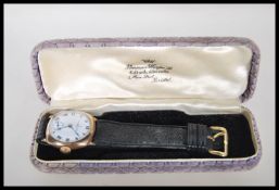 A 20th Century 9ct gold Omega wrist watch, having a white enamel face with bold numeral chapter