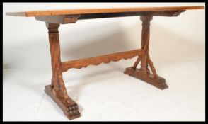 A good Victorian Arts & Crafts solid golden oak refectory dining table being raised on gothic