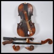 A late 19th/ early 20th Century Violin in pieces, having two piece maple back and spruce front with.