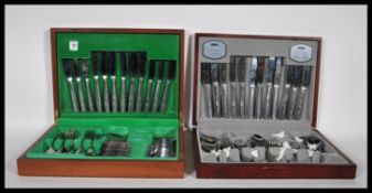 Two vintage 20th Century cased stainless steel canteen of cutlery by Viners, both sets in the