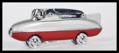 A mid 20th Century 1950's Sarome Bluebird novelty cigarette lighter, finished in red and grey with