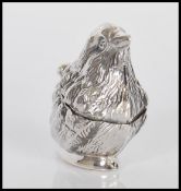 A stamped 925 silver vesta case in the form of a bird having match striker to base. Weighs 21.3g.