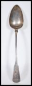 A 19th Century Georgian John Lias silver hallmarked serving spoon having an engraved crest to the