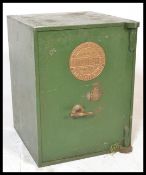 A 19th Century Victorian cast iron safe with key, makers plaque to door for Milners being of