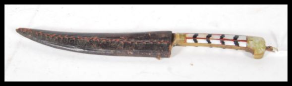 A early 20th Century dagger/ knife, having brass, jade and mother of pearl decorated handle with