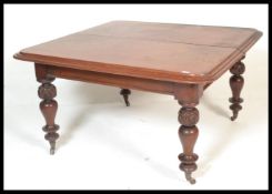 A 19th Century Victorian mahogany large extending dining table table. Circa 1850, the table being