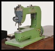 A vintage mid 20th Century circa 1950's Elna Type 500970 sewing machine,110/120V SWISS