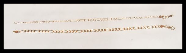 A hallmarked 9ct gold figaro link chain bracelet having a lobster clasp. Bearing import hallmarks