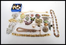 A collection of vintage costume jewellery to include a resin and foil panel opalescent necklace, a