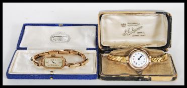 A 9ct gold ladies cocktail watch, enamel face with Arabic numerals, set to a gilt metal expanding