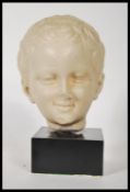 A 20th Century B.M. Replica ( British Museum ) resin composition head of Greek god Eros from the