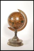 A 20th Century Georgian revival Italian style desktop terrestrial globe raised on a turned fruitwood