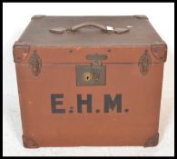 A large  early 20th Century canvas and leather bound hat box / steamer trunk, the hinged top with