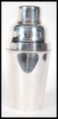 A vintage early 20th Century silver plated Art Deco cocktail shaker of stepped conical form. Stamped