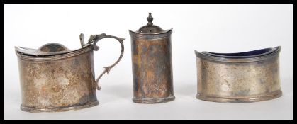 A set of three Jays silver condiments to include pepperette, table salt with a blue glass liner
