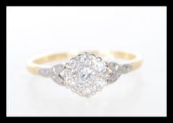 An early 20th Century Art Deco 18ct gold and platinum ring illusion set with white stones to the