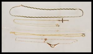A group of five hallmarked 9ct gold necklaces of various lengths and design to include two with
