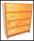 A vintage retro 20th Century Teak wood chest of four straight graduating drawers, the drawers fitted