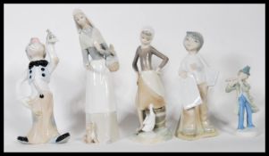 Two ceramic Lladro figurines of young girls holding flowers together with three Spanish made