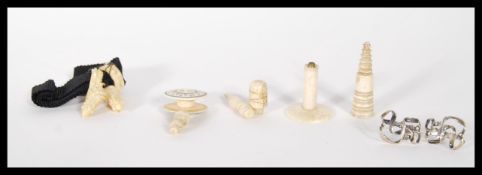 A collection of 19th century Ivory items to include chess piece, thimble, thread holder and other