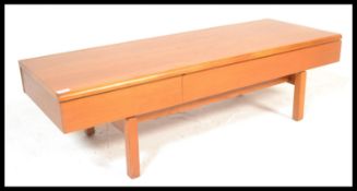 A vintage 1980's teak wood Jentique coffee / occasional table table having a configuration of two