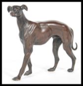 An early 20th Century well cast bronze, the bronze modelled as a greyhound dog on all four legs