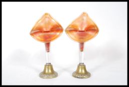 A pair of 19th Century Victorian spill vases having carnival glass orange luster spills with brass