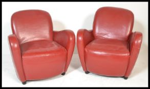 A contemporary red leather 3 piece suite to include a pair of red leather upholstered tub