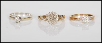 A group of three 9ct gold ladies rings to include a hallmarked solitaire ring set with a round cut