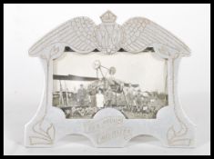A Royal Flying Corp ( RFC ) World War 1 ( WW1 ) aluminum Trench Art easel picture frame, having