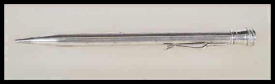 A 20th Century stamped sterling silver propelling pencil having engine turned decoration and