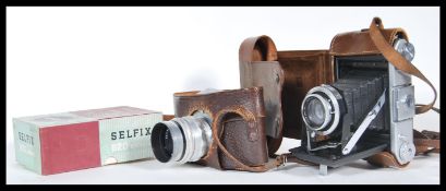 Two vintage 20th Century film cameras to include a Exakta Ihagee Dresden film camera with a Carl