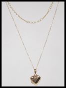 A 9ct gold hallmarked heart shaped pendant locket and chain together with a figaro linked necklace