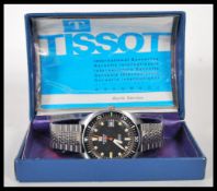 A gentleman's vintage Tissot Swiss Navigator automatic stainless steel wrist watch having a round
