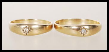 Two matching hallmarked 9ct gold rings both being gypsy set with cubic zirconia stones. Both
