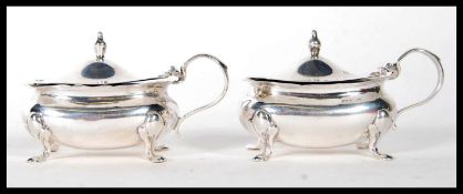 A pair of silver hallmarked Wilson & Sharp table condiments bearing Birmingham marks with date