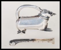 A 20th Century decorative silver padlock in the form of a temple dog having stylised stylised