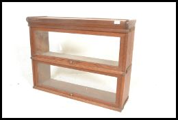 A pair  / stack of Globe Wernicke manner lawyers stacking bookcases. Each of golden oak construction