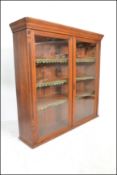 A Victorian large mahogany library bookcase cabinet having twin full length glazed panel doors