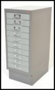 A mid century Industrial metal office upright filing cabinet in the original grey colourway having