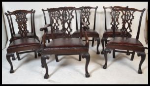 A set of seven Irish Chippendale revival carved mahogany dining chairs, circa 1900, including one