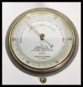 A vintage 20th Century Negretti & Zambra circular cased fisherman's aneroid barometer issued by