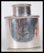 A 19th Century Victorian silver hallmarked tea caddy having gadrooned bordered having engraved