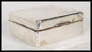 An early 20th Century Mappin & Webb silver hallmarked cigarette box having engine turned