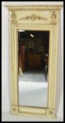 A Regency revival style pier wall mirror, the bevelled edge mirror flanked by columns with swags