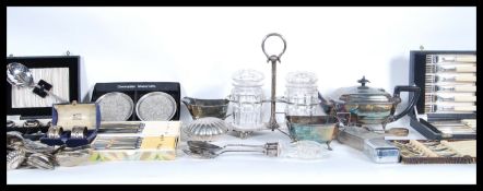 A collection of silver plate items to include boxed flat wear, cutlery, napkin rings, a pair of