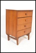 A 1970's Danish inspired teak wood pedestal chest of drawers by Remploy. Raised on tapering legs