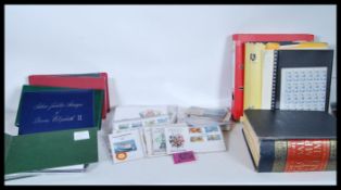 A collection of world stamps and first day covers dating from the early 20th Century to include