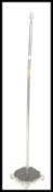 A mid 20th century Art Deco floor standing lamp, having square base and chrome finish. Measures